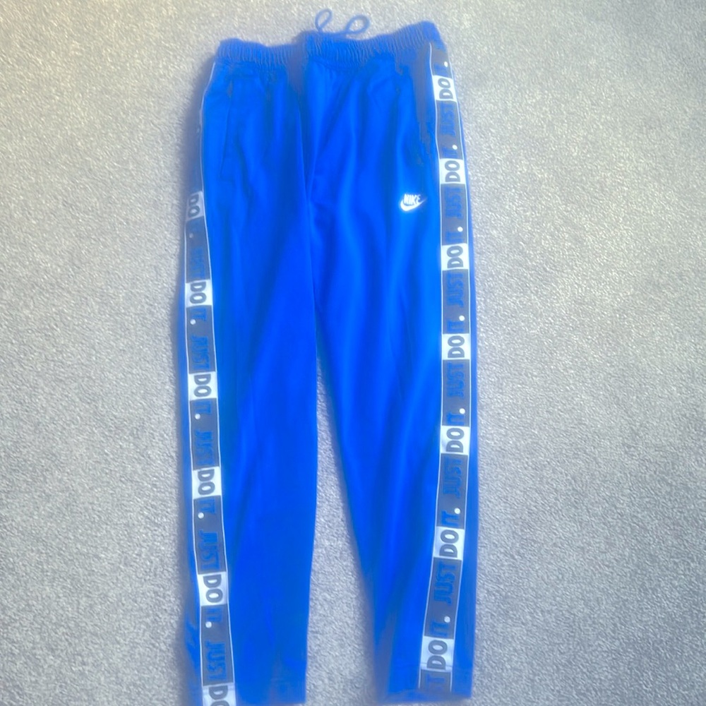 Blue Nike warmup pants size M